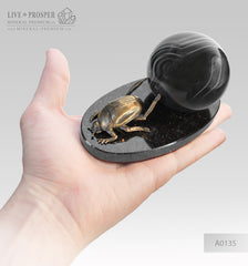 Bronze scarab with an agate sphere on a dolerite plate  Бронзовый скарабей с агатовой сферой на пластине из долерита 