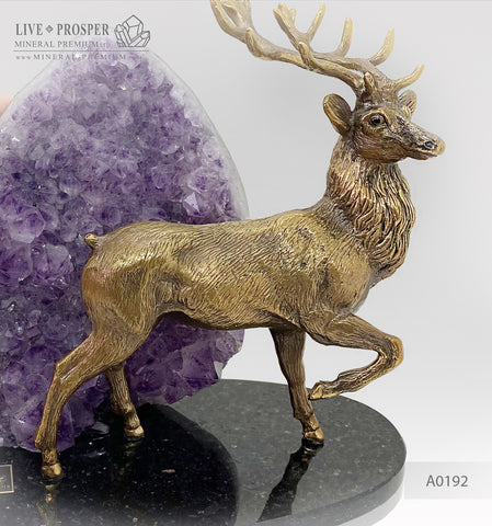 Bronze deer figure with agate geode amethyst druze on a dolerite plate